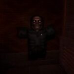 Screenshot from Night At The Infirmary showing a creepy entity with sharp teeth appearing through the wall.